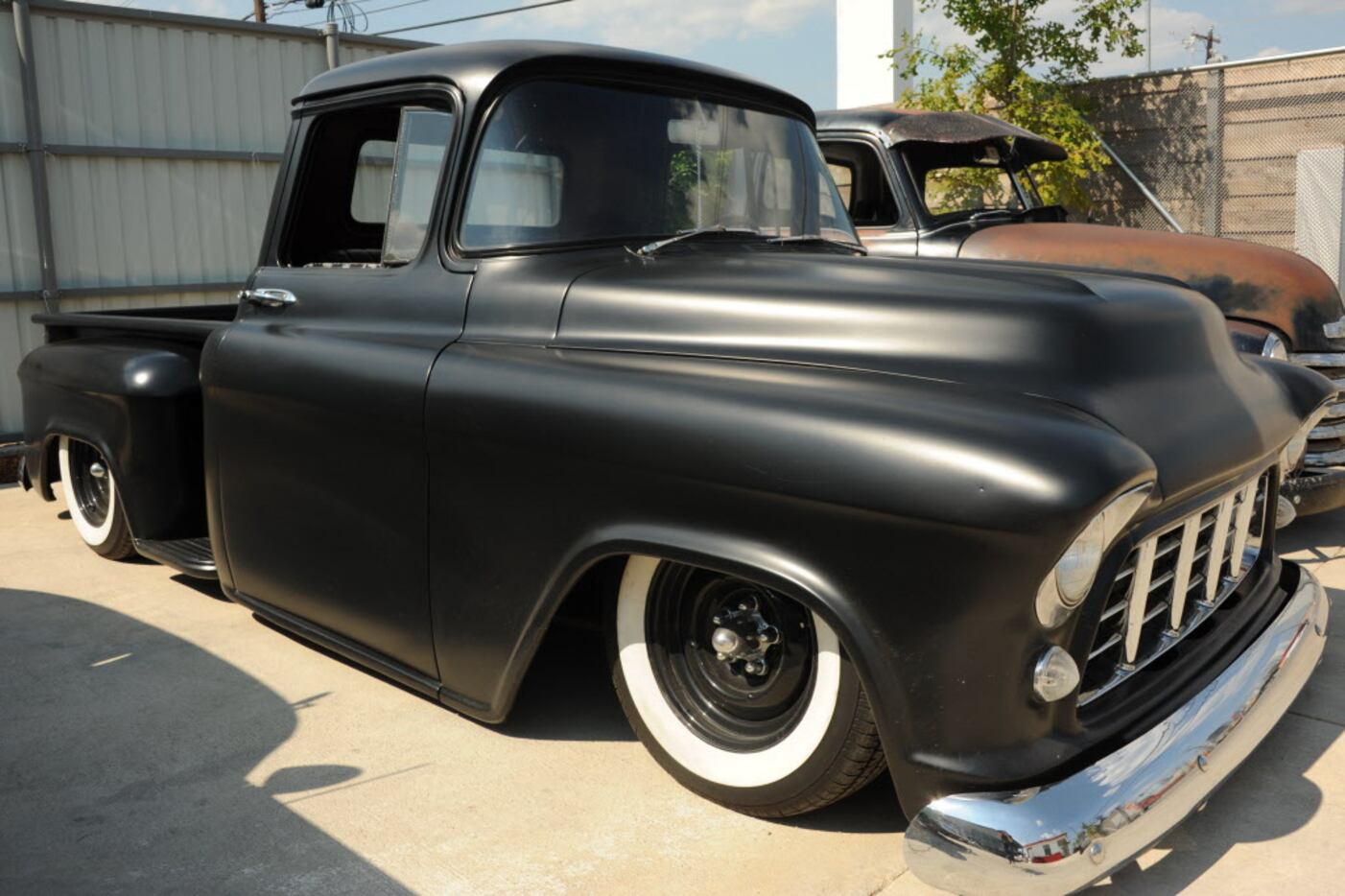 A lowered and painted '50s truck is on display at the custom car show at Texas Ale Project...