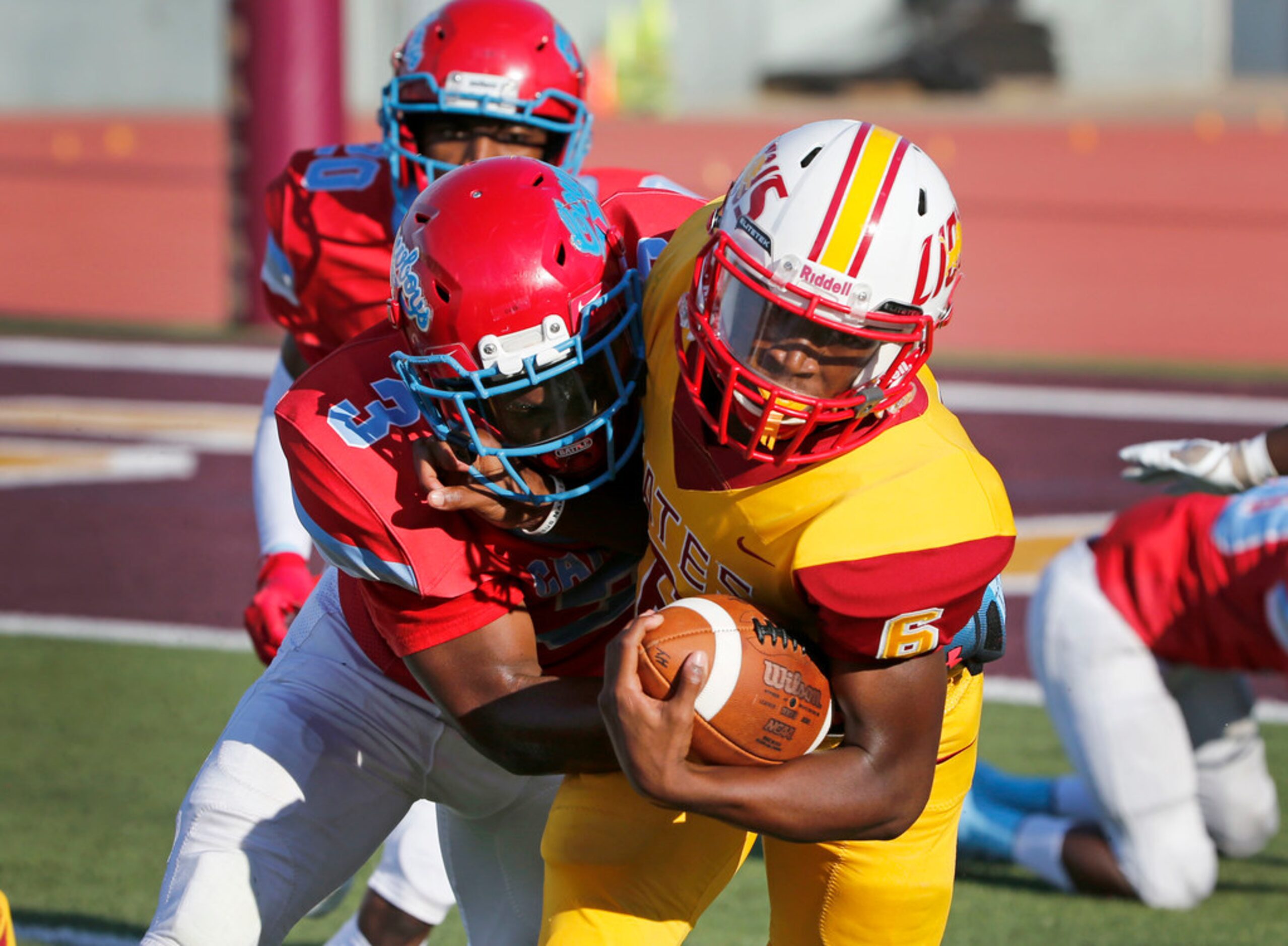 Dallas Carter defender Caleb Jackson (3) tackles Houston Yates quarterback Dominick Martin...