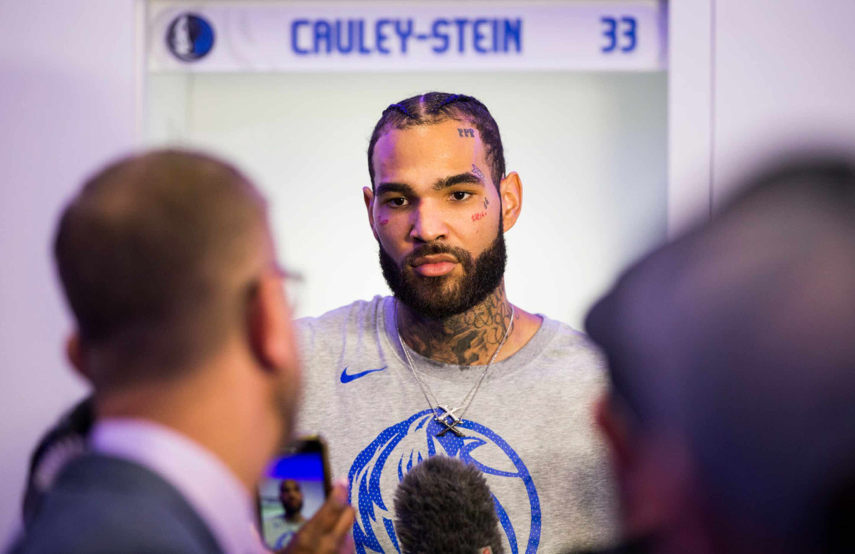 Dallas Mavericks center Willie Cauley-Stein (33) speaks to reporters in the locker room...