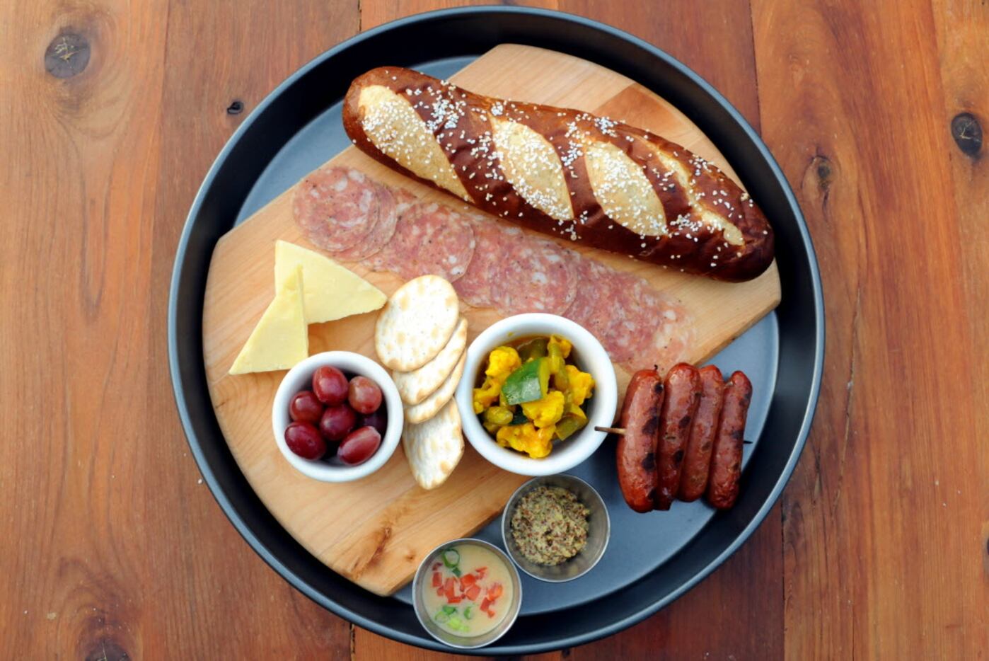 The beer companion features jalapeno-cheese brats, Milano salami, Quickes English cheddar,...