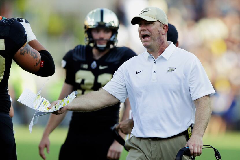 FILE - In this Sept. 23, 2017, file photo, Purdue head coach Jeff Brohm yells to an official...