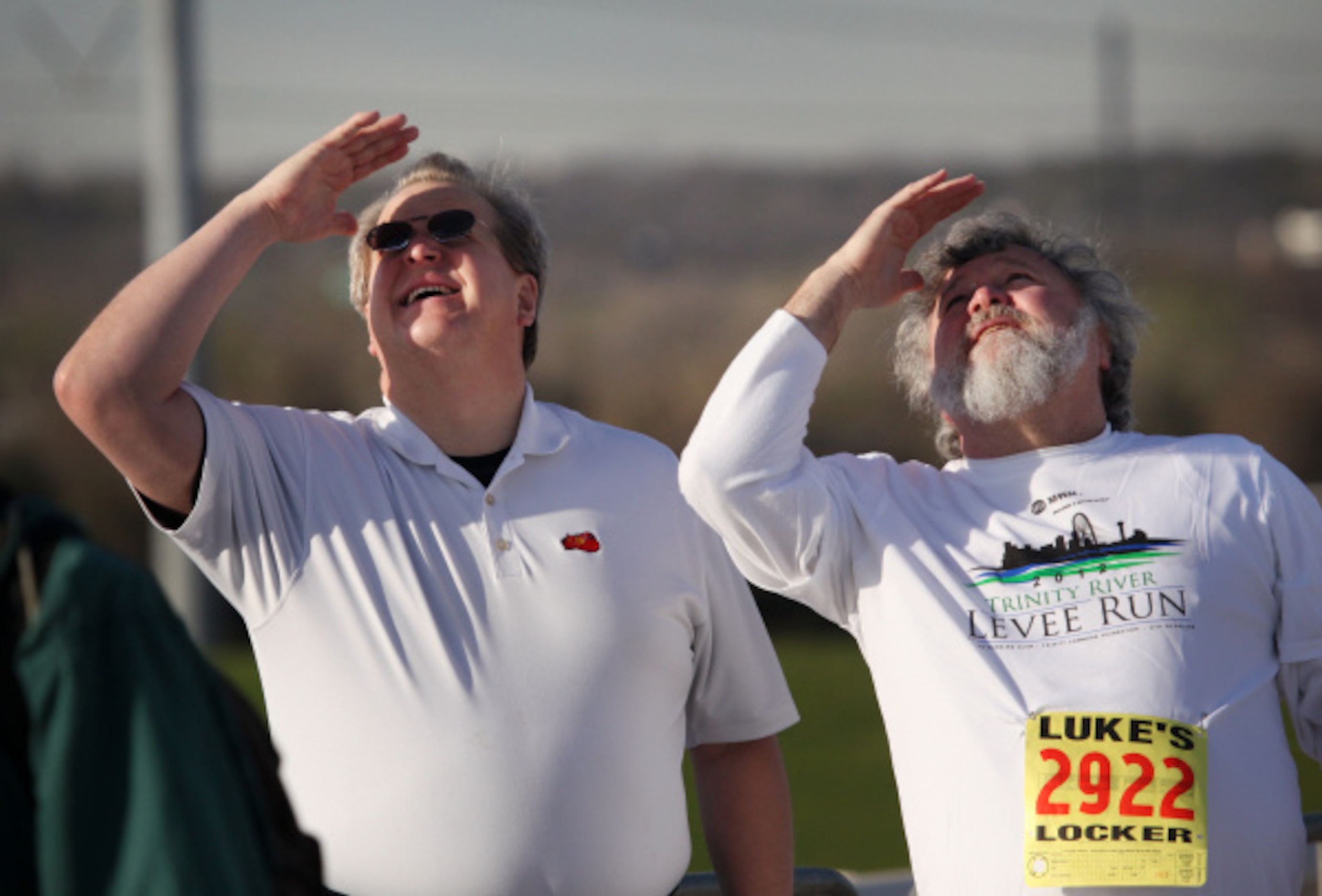 From L to R, participants Bill Krueger and Jim Gerken, both from Dallas, look the top of the...