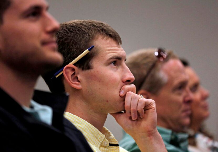 
Ethan Swartz, a seminary student, listens to Nancy and David Writebol describe the Ebola...