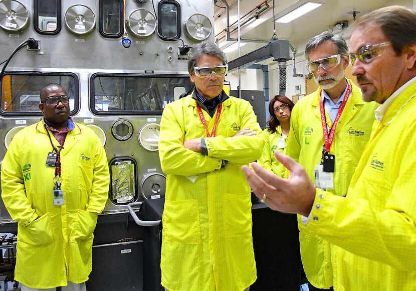 U.S Secretary of Energy Rick Perry, second from left,  learns about capabilities at the Los...