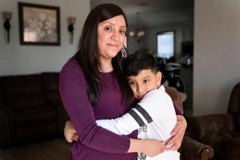 Cynthia Medina, 27, poses for a portrait with her son Aaron Villegas, 8, at her home in West...