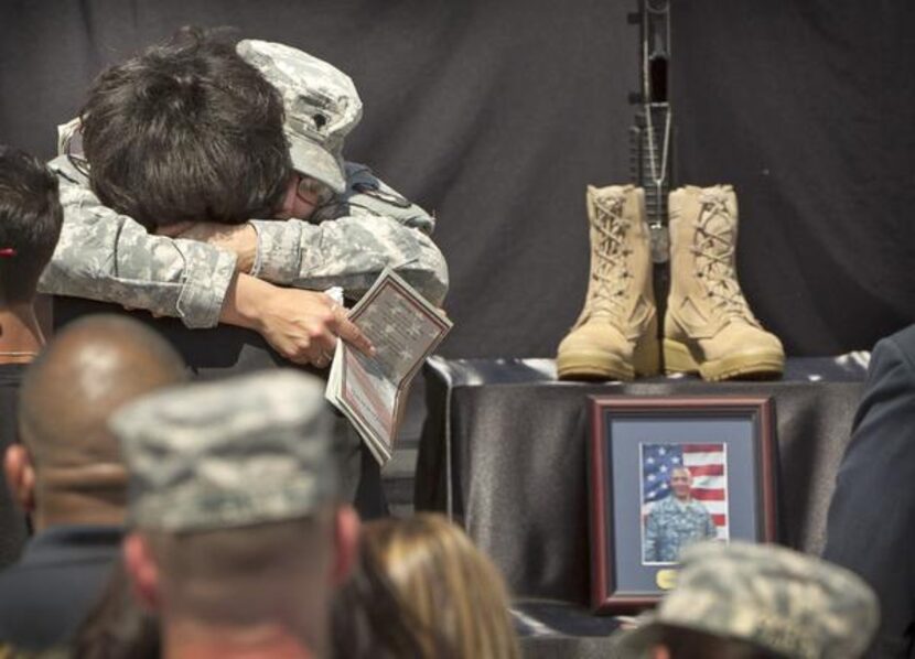 
Spc. Kristen Haley, the fiancée of Sgt. 1st Class Daniel Ferguson, who was one of the three...