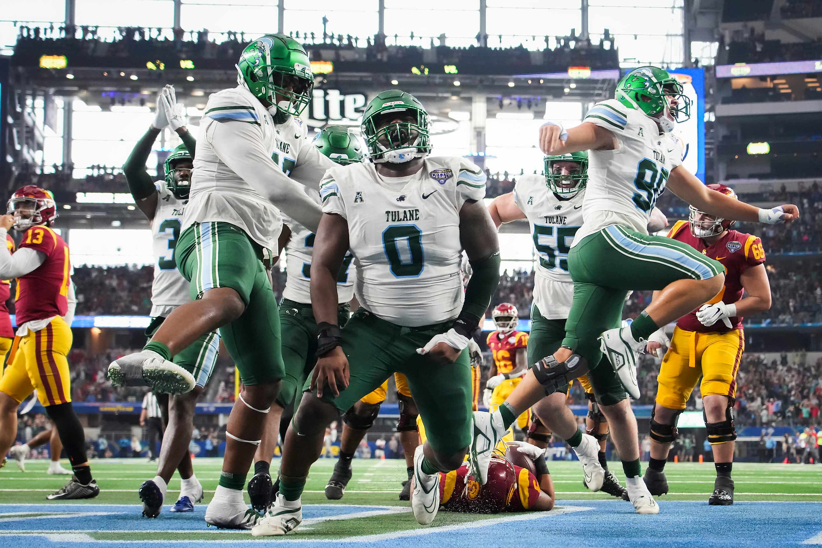 Tulane defensive lineman Patrick Jenkins (0) celebrates after stopping USC running back...