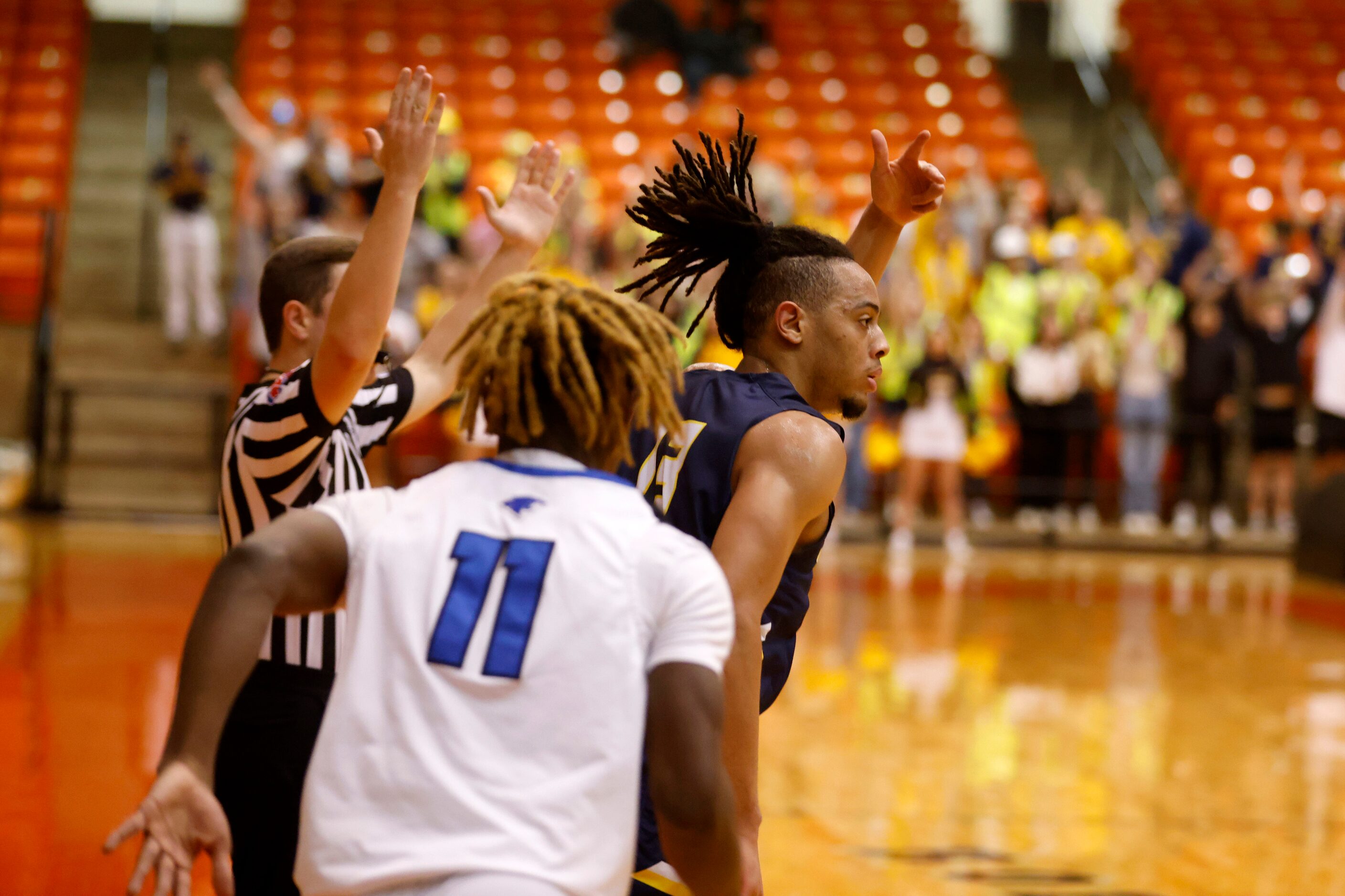 McKinney’s Devin Vincent (13) reacts to a three point basket in front of North Crowley’s ...