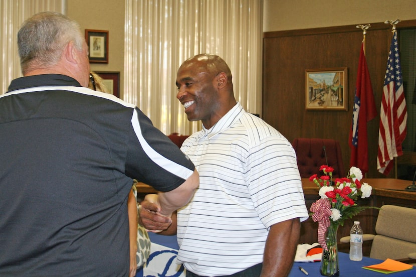 Charlie Strong visits with people attending "Charlie Strong Day" which was held in his...