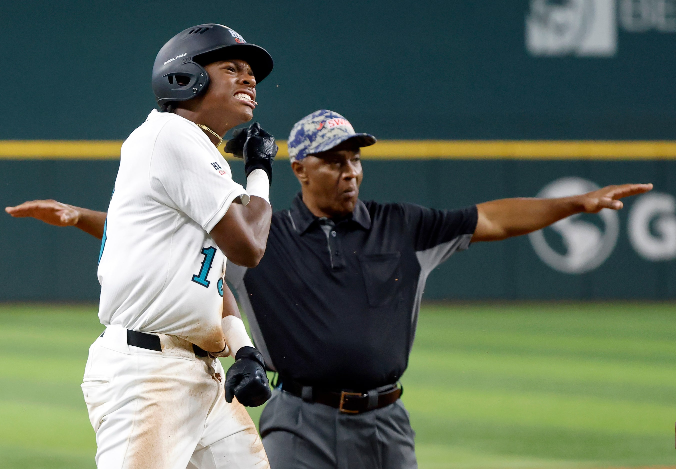 American League batter Robert Tate Jr.(15) reacts after hitting a triple during the third...