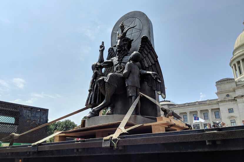 The Satanic Temple unveils its statue of Baphomet, a winged-goat creature, at a rally for...