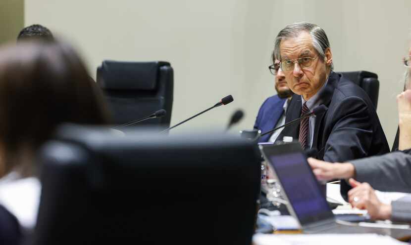 P. Michael Jung (right), a member of the City Plan Commission, listens to questions during a...