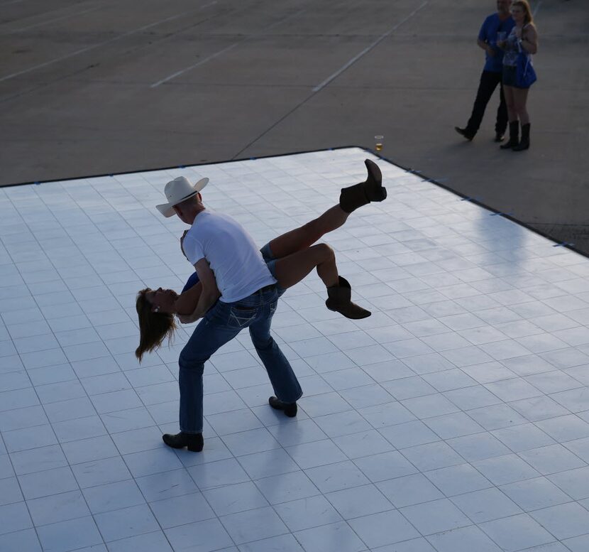 Robbin Biggersteff is lifted by Dale Litton, both of Dallas, while dancing during the Off...