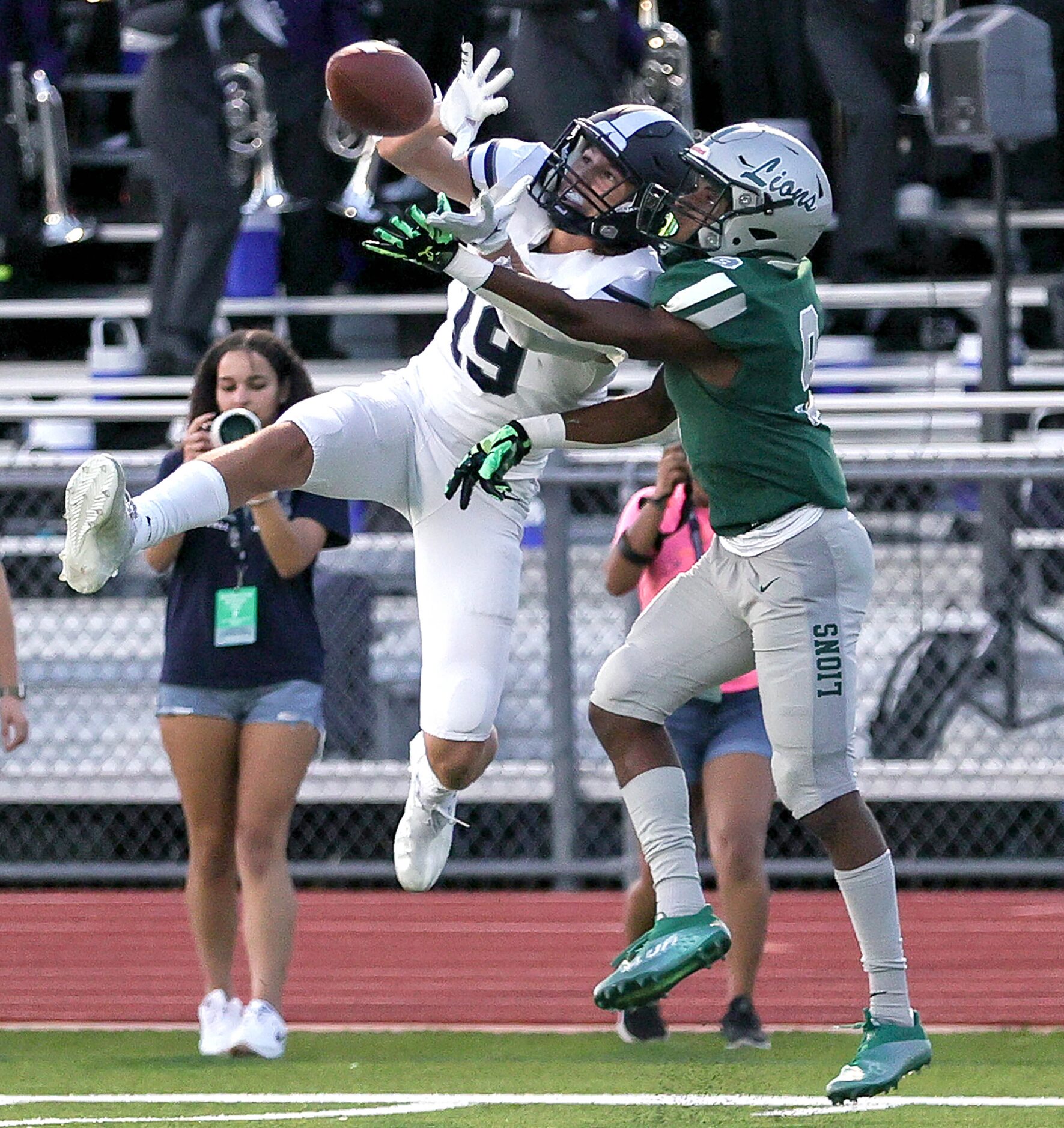 Frisco Lone Star wide receiver Chris Viveros (19) comes up with a 8 yard touchdown reception...