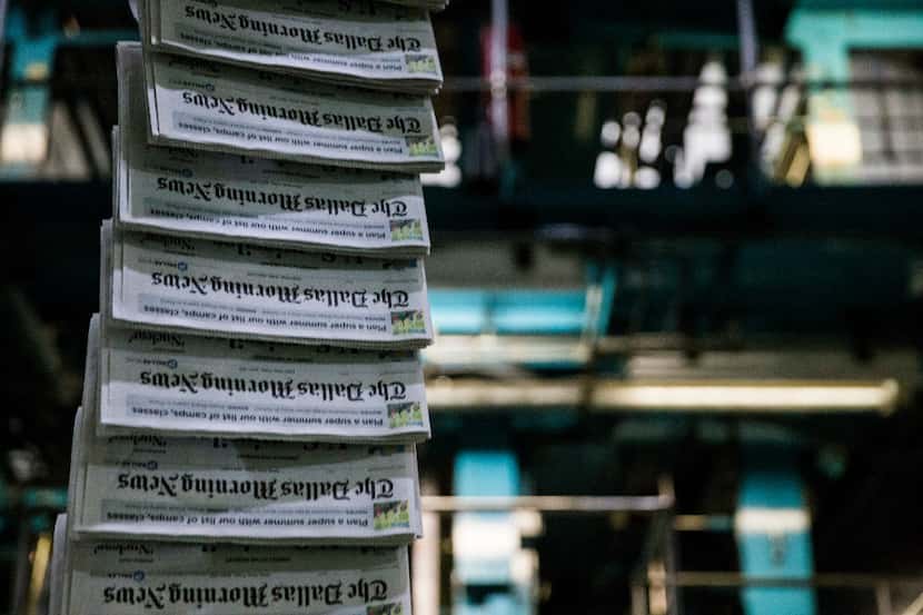 Copies of The Dallas Morning News on the printing presses