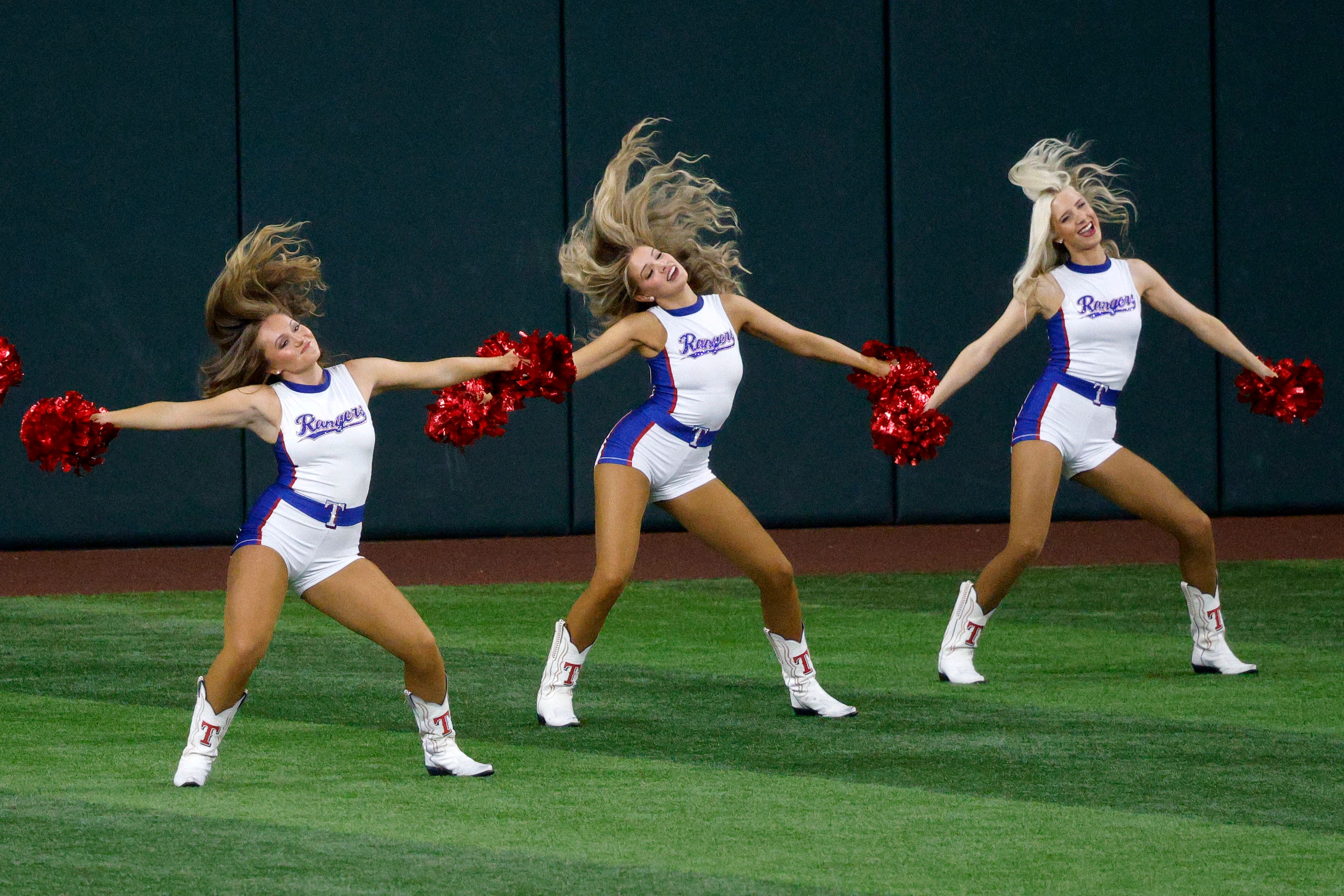  Members of theTexas Rangers Six Shooters perform before a baseball game against the New...