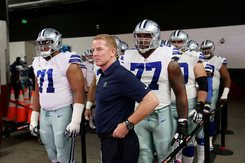 Dallas Cowboys head coach Jason Garrett and his team prepares to enter the field before a...