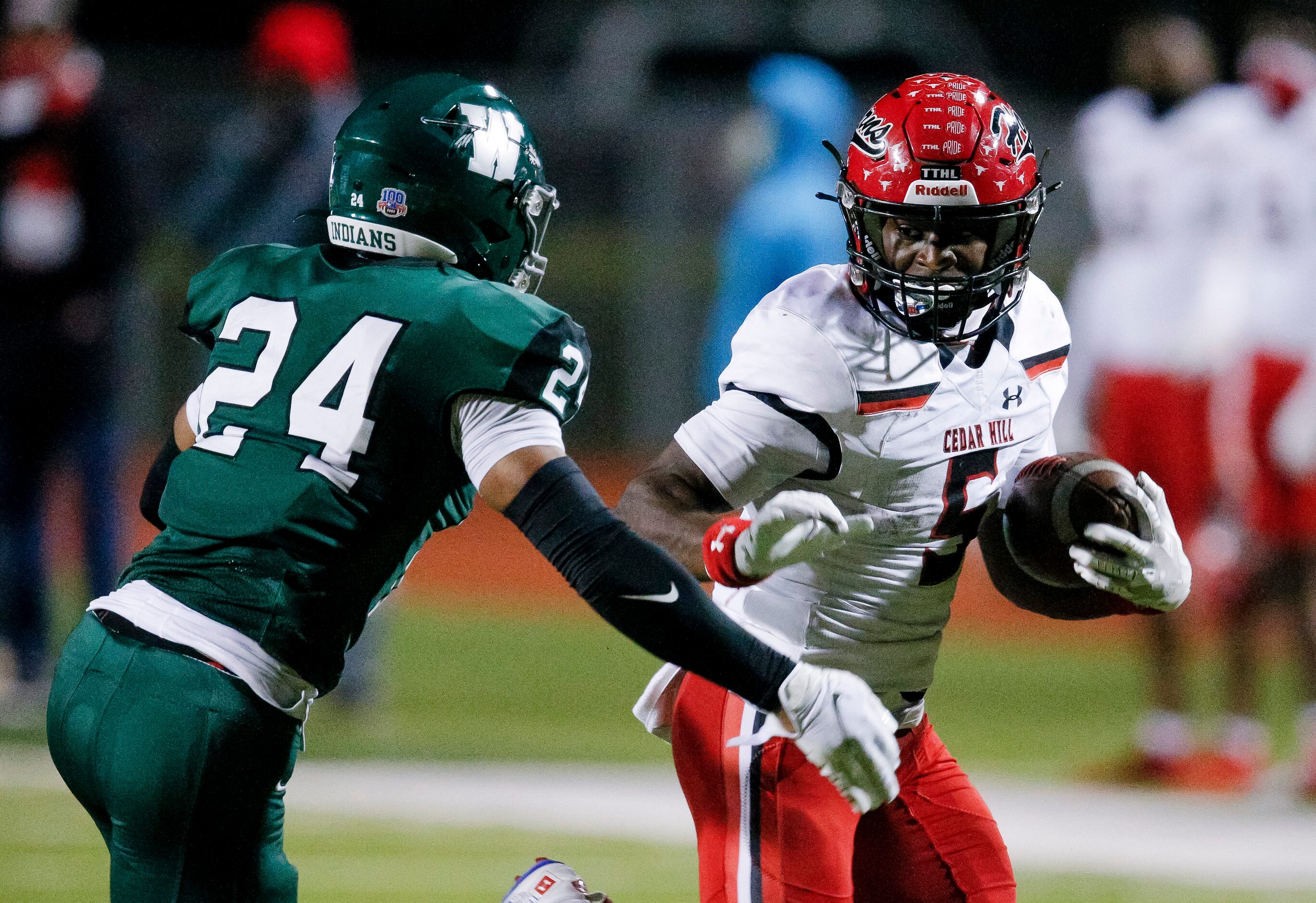 Cedar Hill senior running back Kevin Young Jr. (5) looks for room against Waxahachie senior...