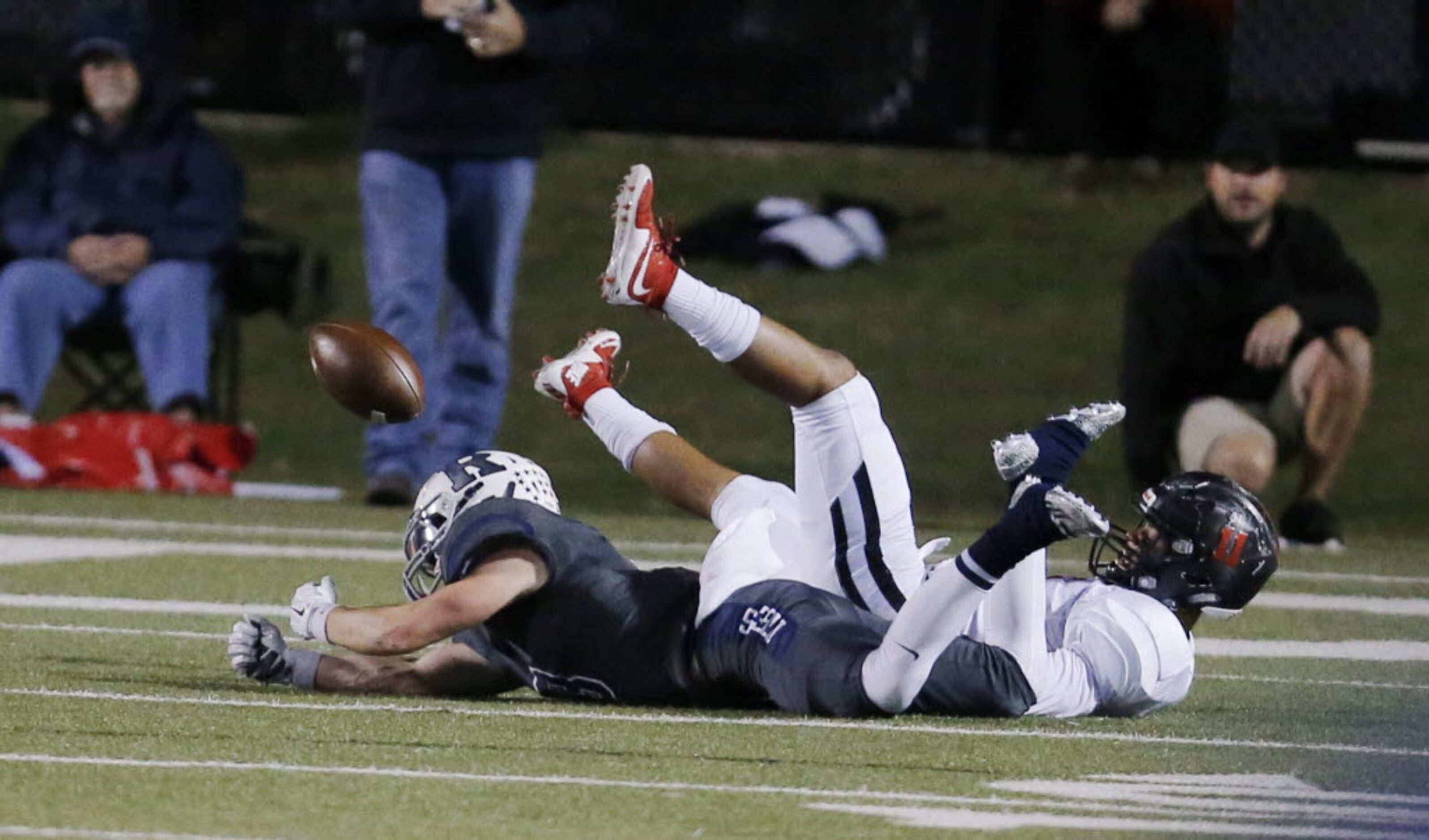 Richland's Colton Curtis, foreground, is unable to catch a pass as Colleyville Heritage...