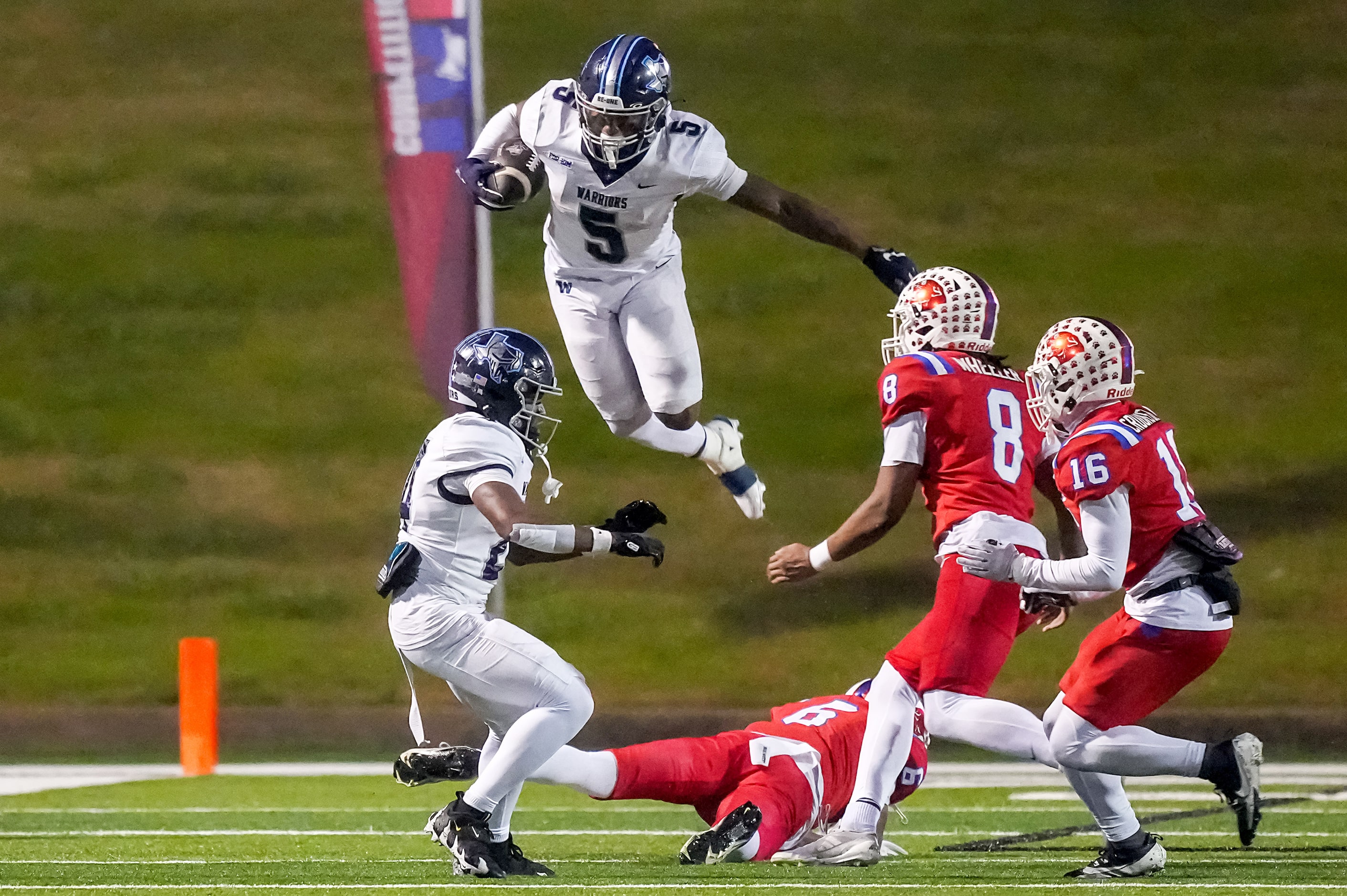 Argyle Liberty Christian running back Chase Garnett (5) hurdles Parish Episcopal defensive...