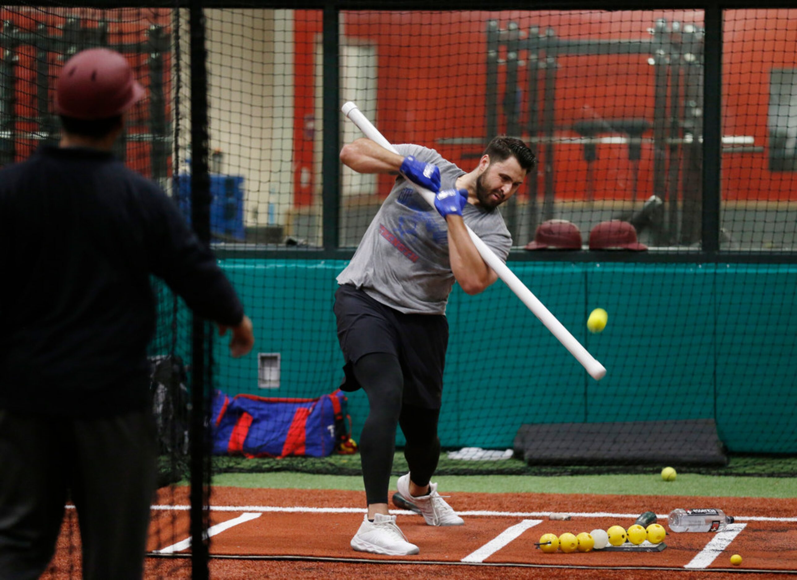 Texas Rangers Joey Gallo (13) works with Texas Rangers hitting coach Luis Ortiz (18) in the...