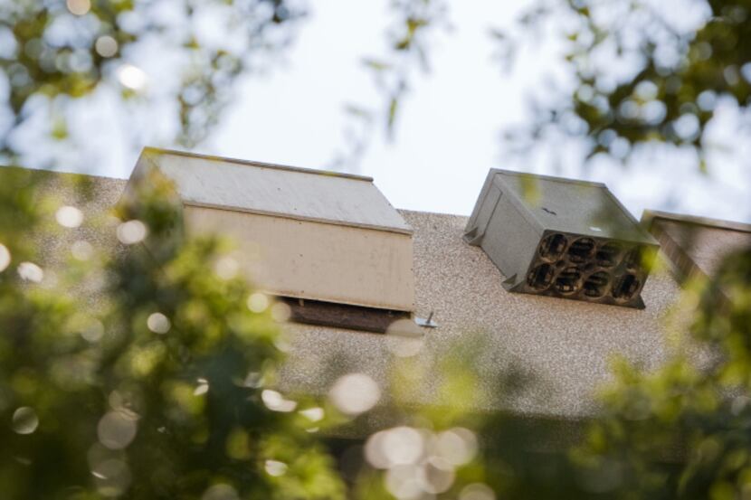 Bat boxes mounted to the side of the Fort Worth Convention Center parking garage provide a...