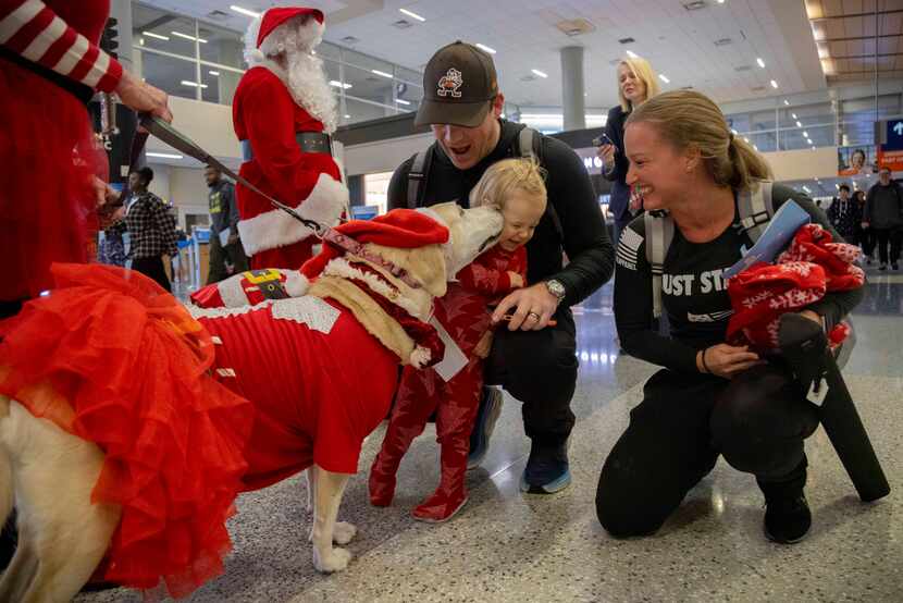 (From left) Jim Ciccone and Alicia Ciccone from California watch as 21-month-old daughter...