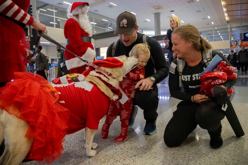 (From left) Jim Ciccone and Alicia Ciccone from California watch as 21-month-old daughter...