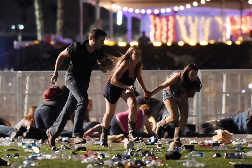 People ran from the Route 91 Harvest country music festival after the gunfire erupted....