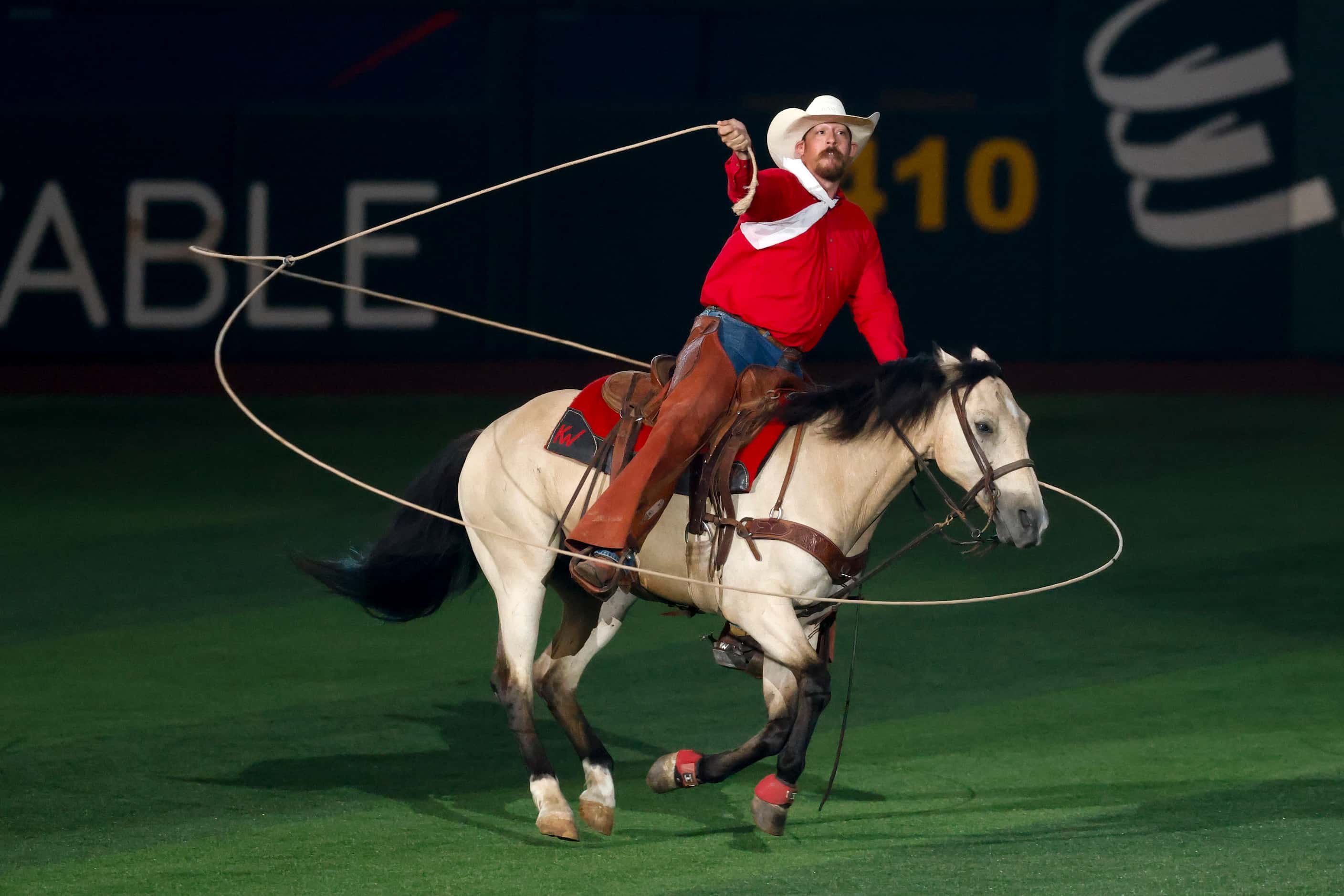 A trick-roper performs in the outfield at Globe Life Field before the MLB All-Star Game,...