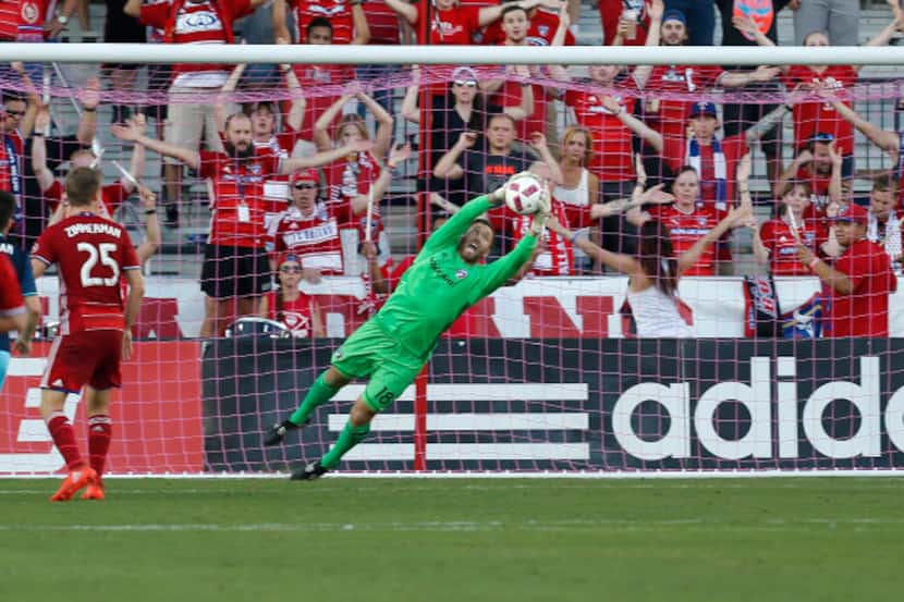 FC Dallas midfielder Chris Seitz (18) stops a goal by Seattle Sounders in the second half at...