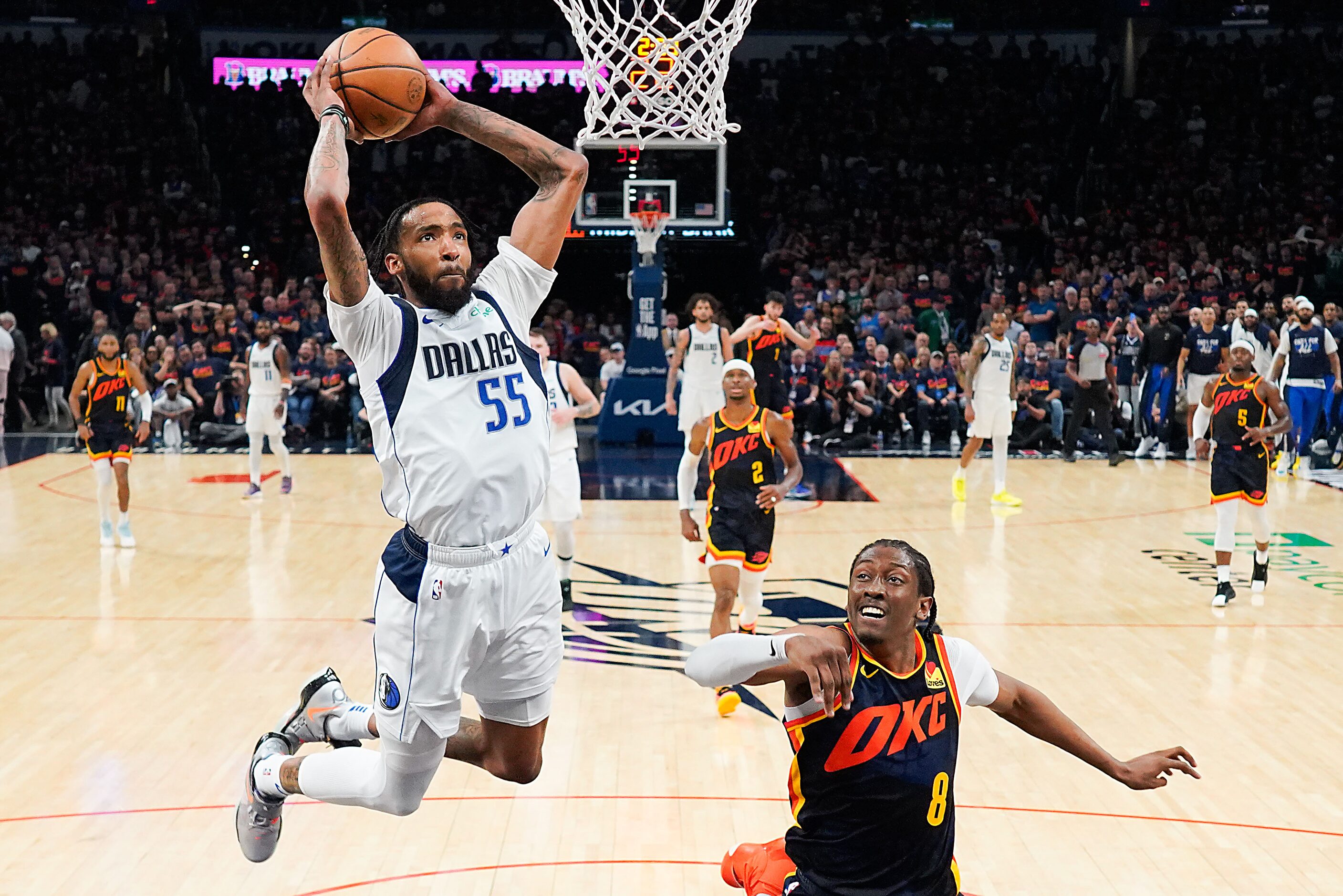 Dallas Mavericks forward Derrick Jones Jr. (55) dunks the ball past Oklahoma City Thunder...