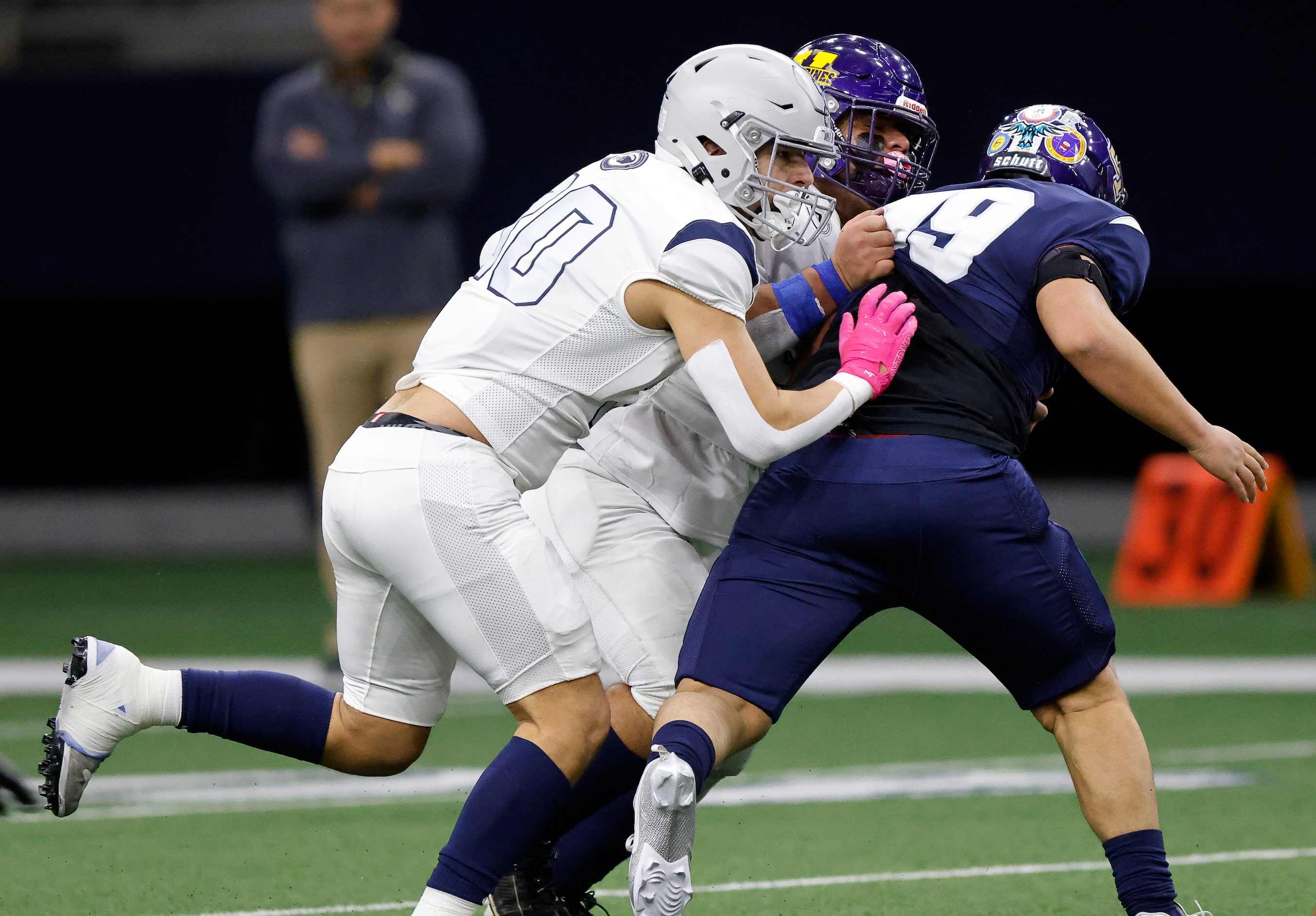 Ta’ Tanka Kayden Holder (30) of Nimitz High (Irving, TX) gets around Wa-Ya’s Isiah Lugo (99)...