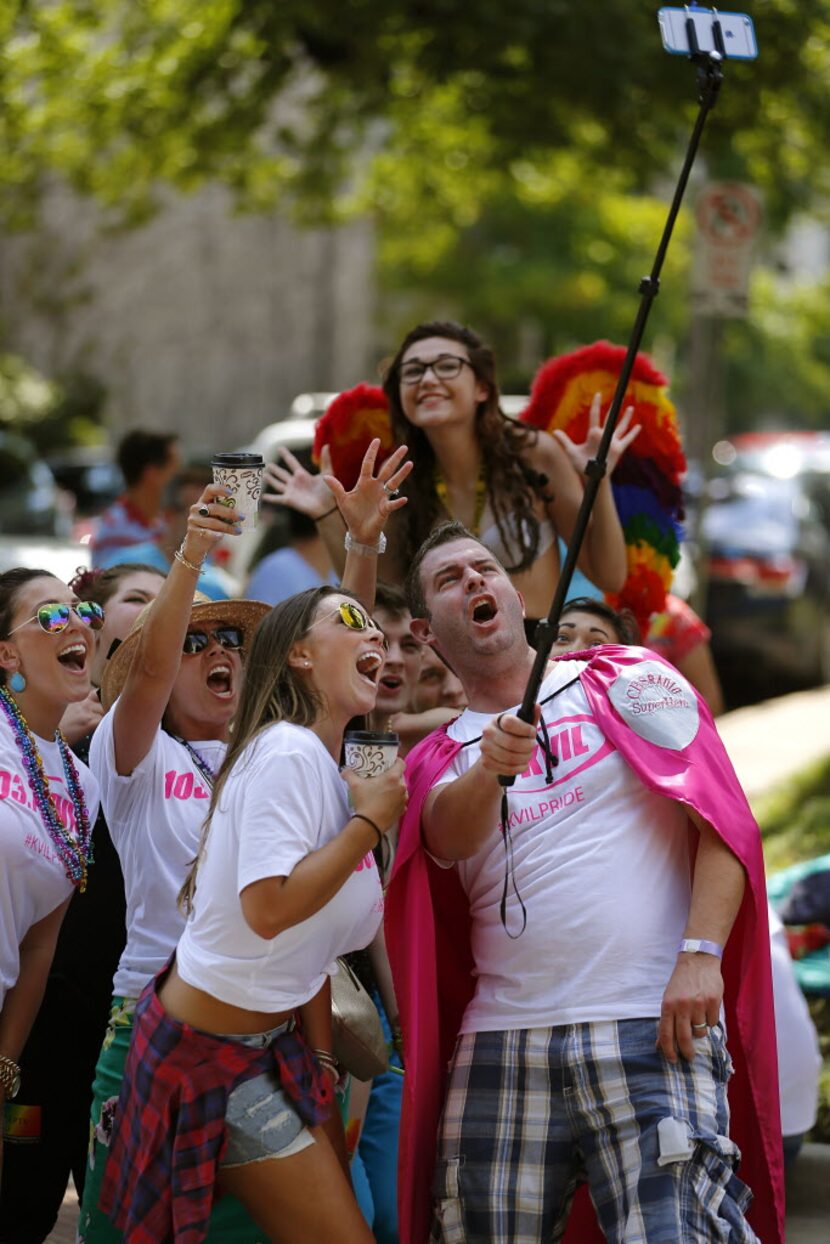 A group from KVIL radio take a selfie with people in the crowd during the Alan Ross Texas...