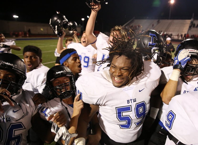 Hebron offensive lineman Chancellor Shepard (59) and his teammates celebrate after earning a...