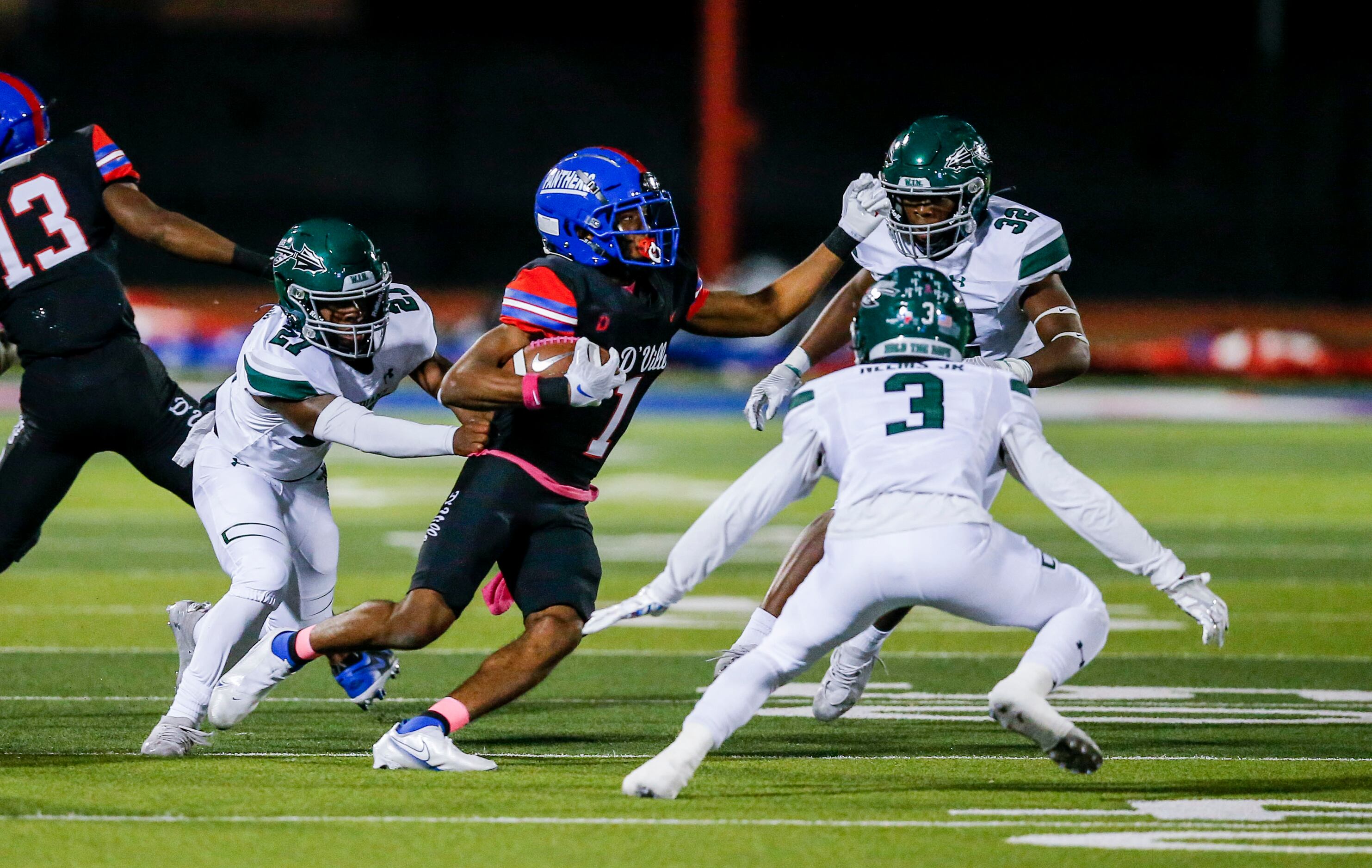 Duncanville junior wide receiver Lontrell Turner (1) looks for room against Waxahachie...