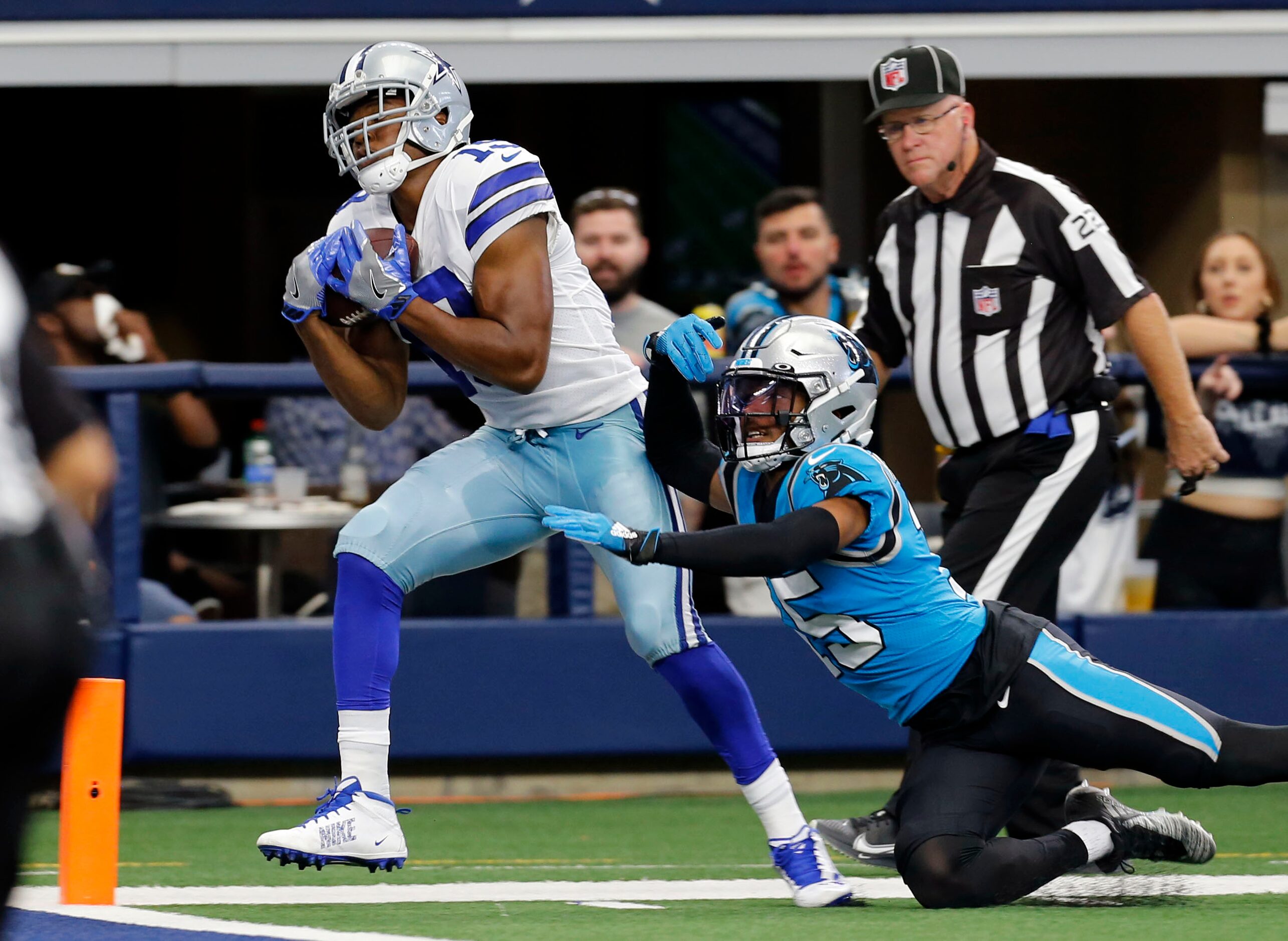 Dallas Cowboys wide receiver Amari Cooper (19) catches a touchdown pass over Carolina...