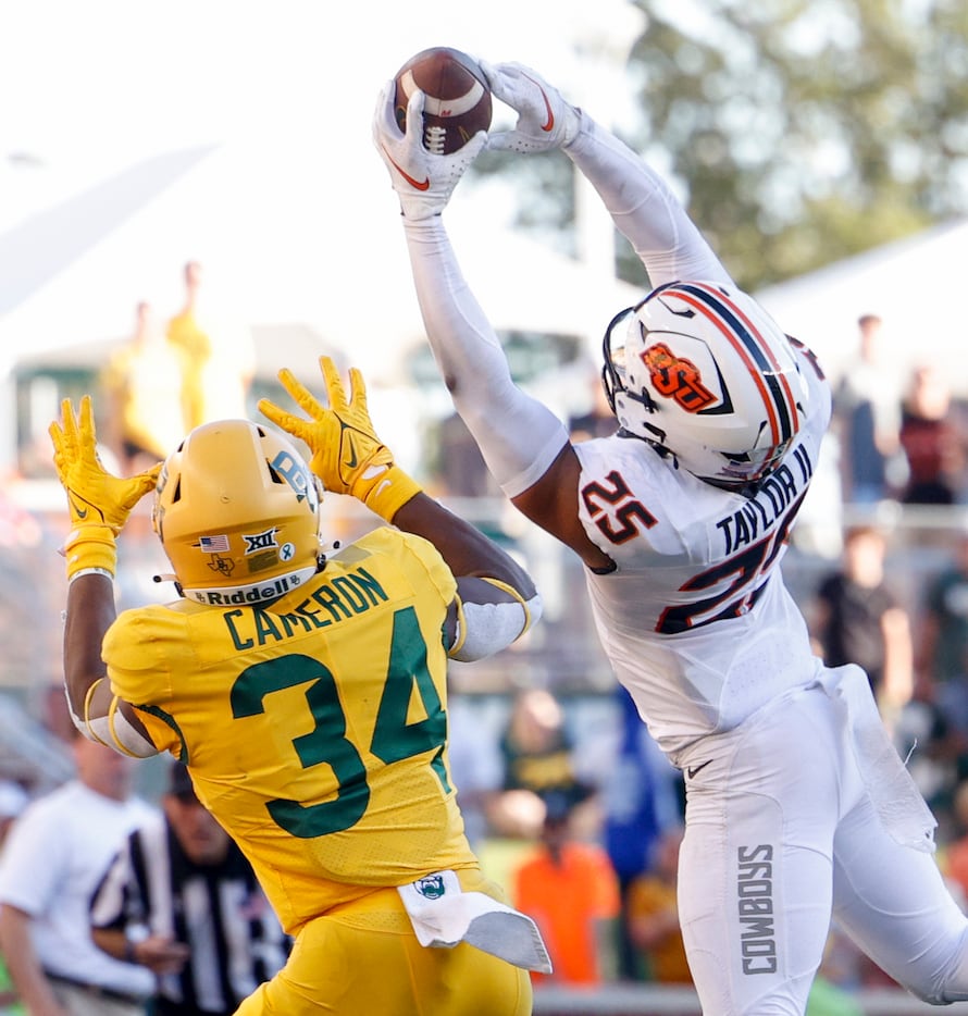 Oklahoma State safety Jason Taylor II (25) intercepts a pass intended for Baylor wide...