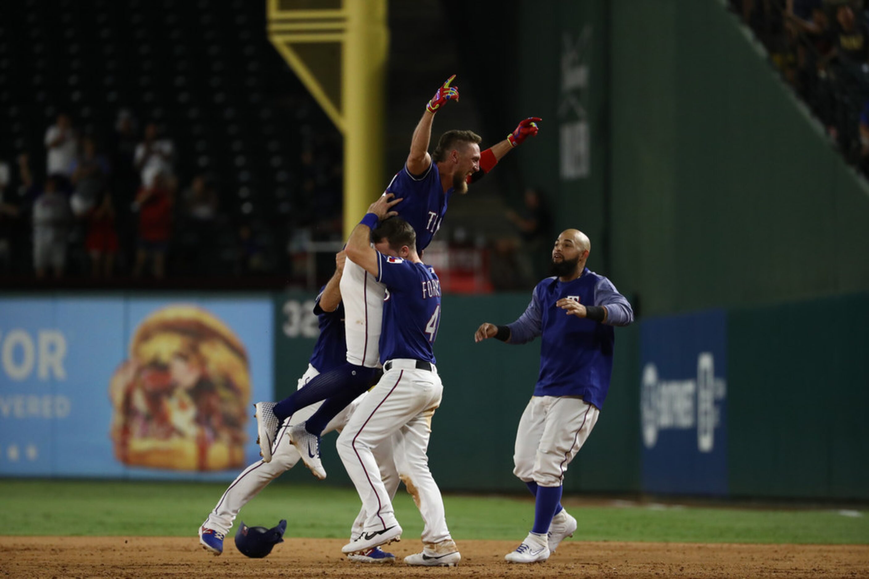 ARLINGTON, TEXAS - AUGUST 21:  Hunter Pence #24 of the Texas Rangers celebrates a walk off...