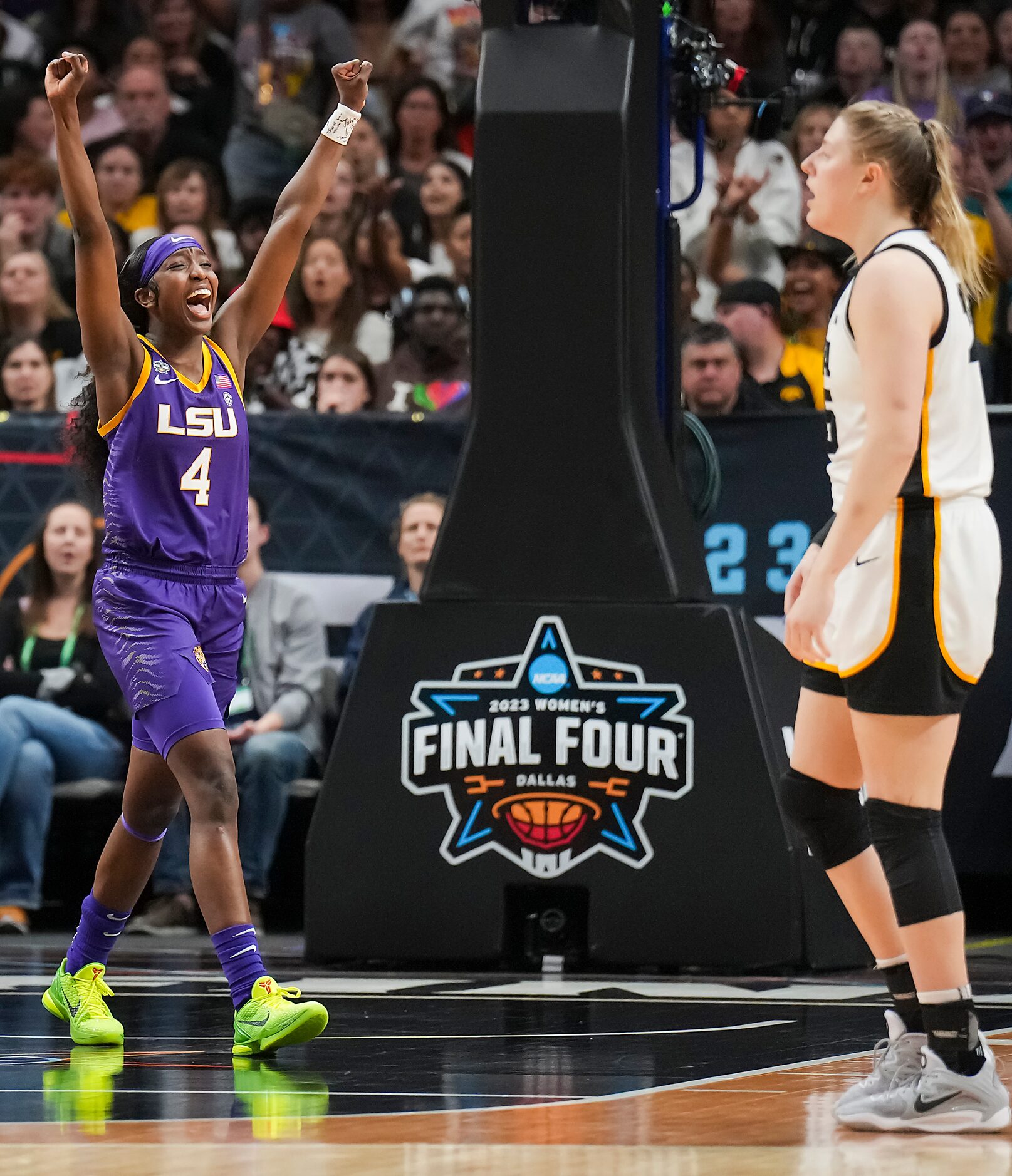 LSU guard Flau'jae Johnson (4) celebrates after Iowa forward Monika Czinano (25) fouled out...