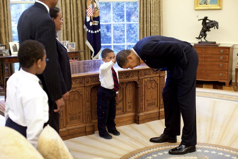 Jacob Philadelphia, 5, center, touched President Barack Obama's hair to see if it felt like...