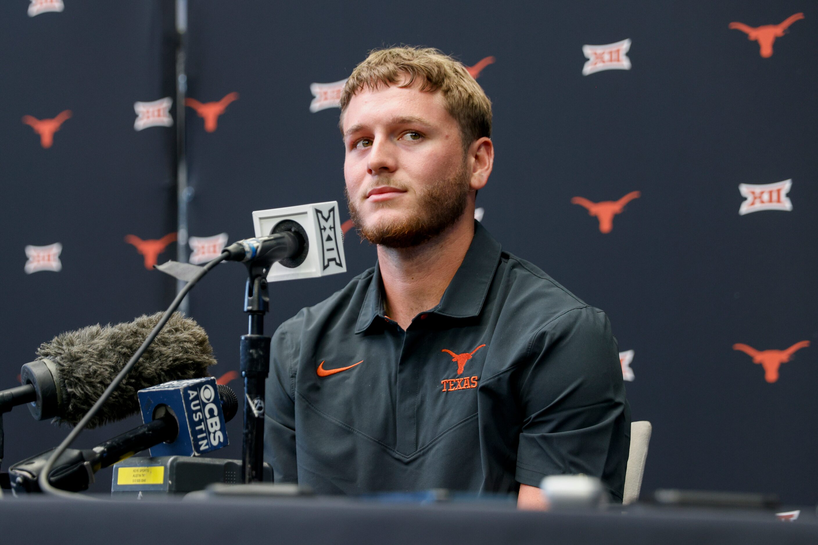 Texas quarterback Quinn Ewers listens to a question from reporters during the Big 12 Media...