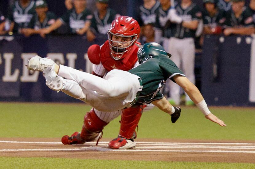 Prosper’s Harrison Rosar (10) is tagged out by Coppell catcher Walker Polk (23) at home...