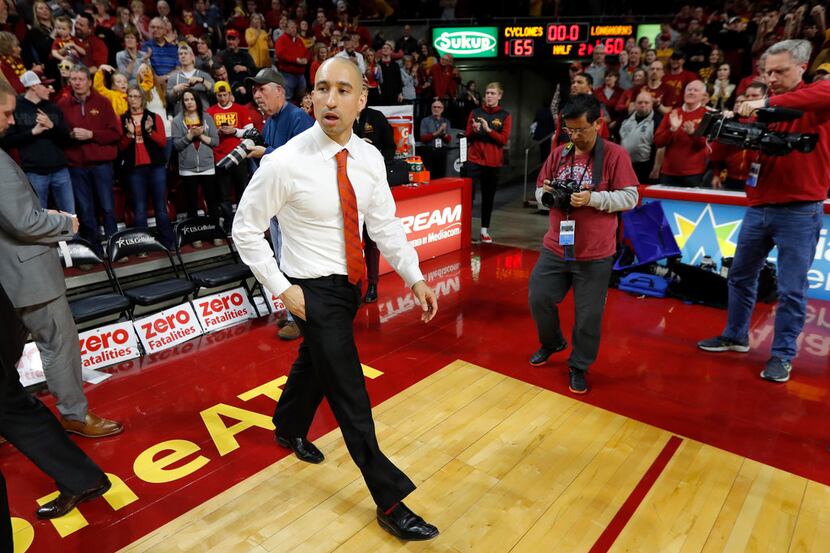 Texas head coach Shaka Smart walks off the court after an NCAA college basketball game...