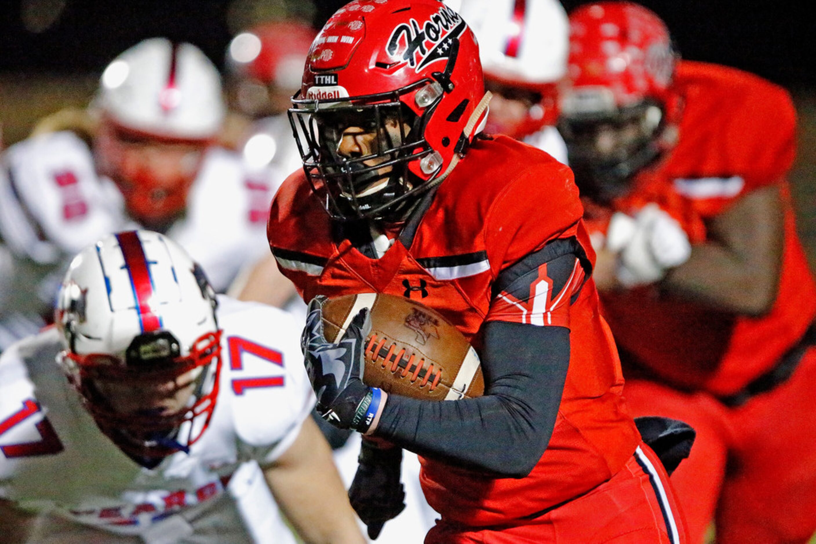 Cedar Hill High School running back Corie Allen (10) carries the ball during the first half...