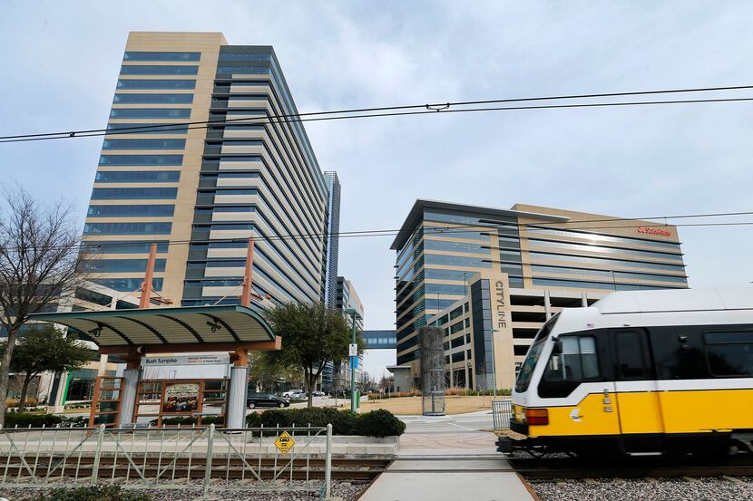 A DART train pulls into the Bush Turnpike station at the State Farm-anchored CityLine...
