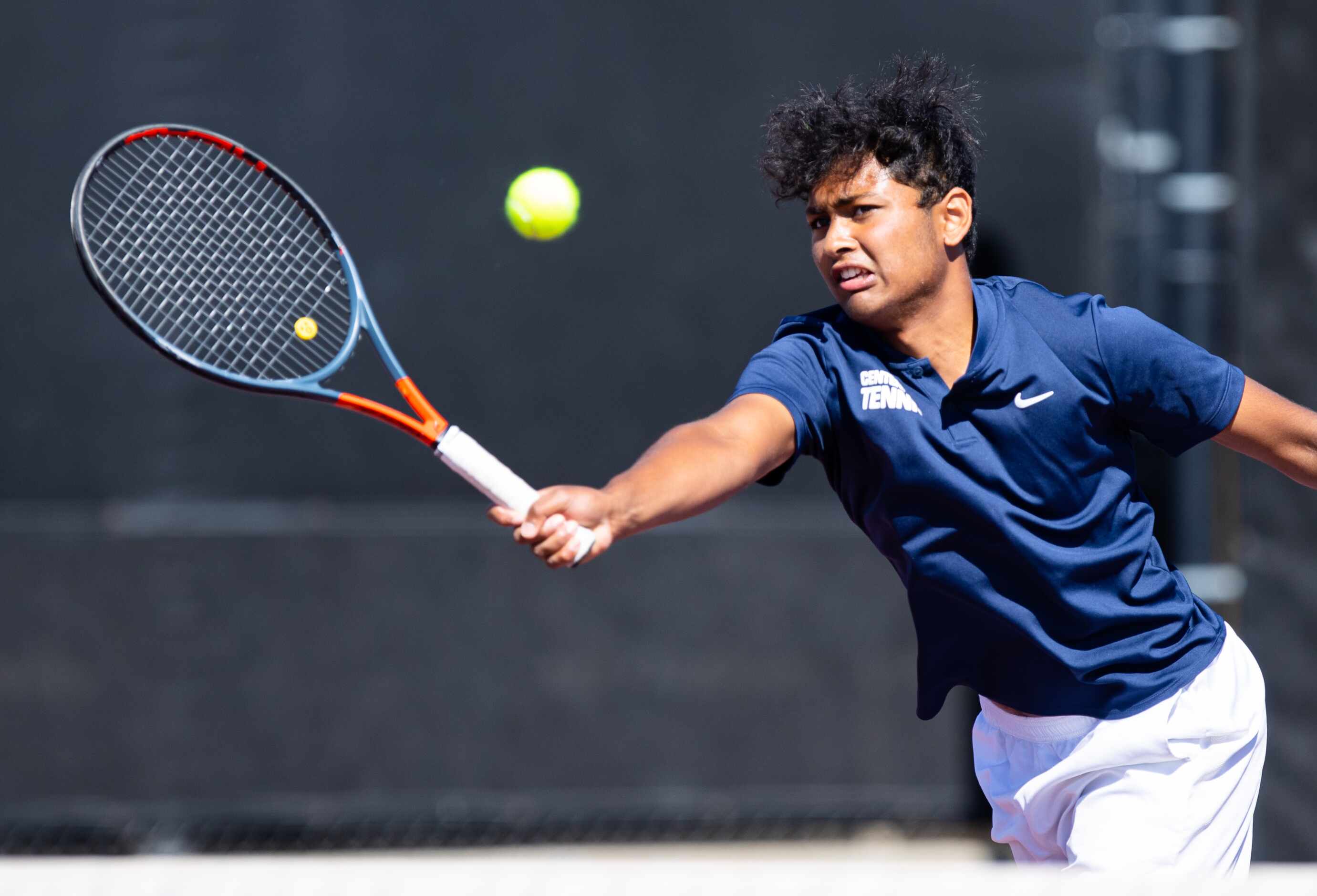 Frisco Centennial’s Rahul Muppavarapu returns a shot during a doubles match with partner...
