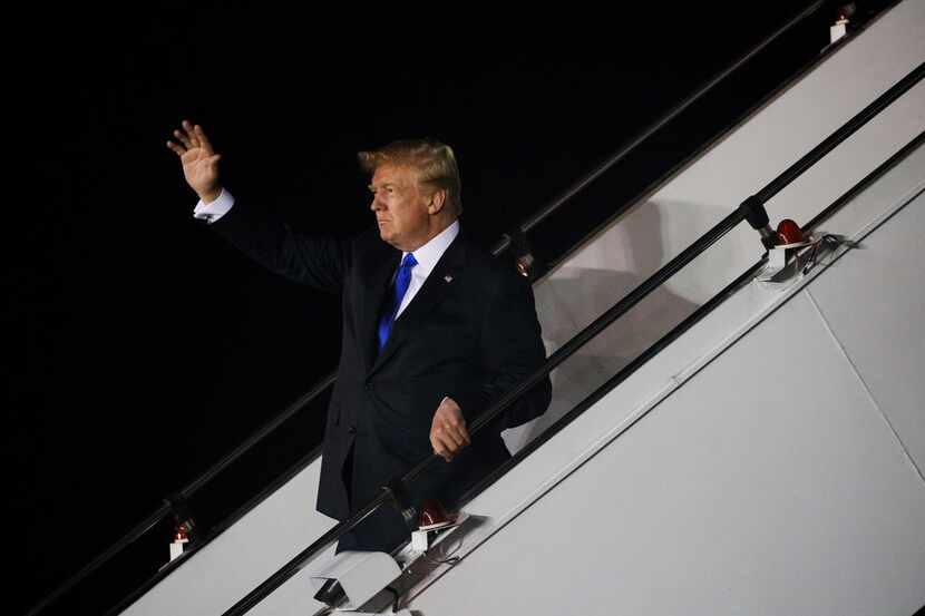 President Donald Trump arrives at Paya Lebar Air Base for a summit with North Korea's leader...