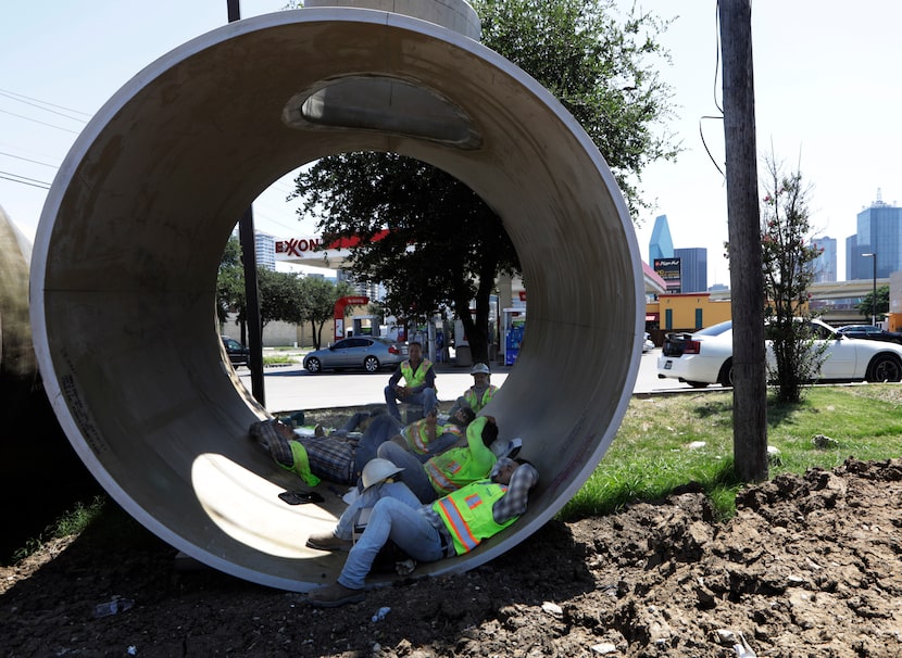 Thalle Construction Company workers J. ReFugio Perez, top left, Lupe Aranda, Prudencio...