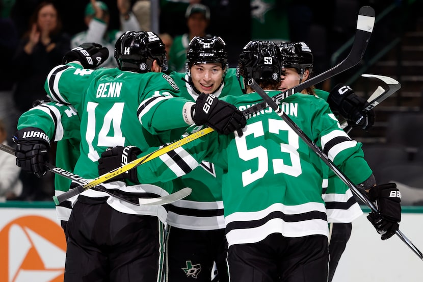 The Dallas Stars celebrate a goal by center Roope Hintz during the first period of an NHL...